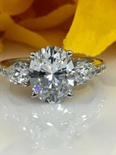 2ct Oval Cut Simulated Diamond Three Stone Solitaire Ring 14k White Gold Plated