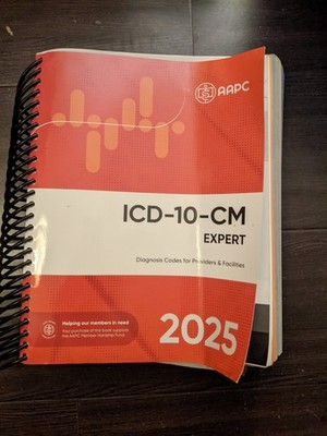 ICD-10-CM Complete Code Set 2025 - Spiral-bound, by AAPC Water Damage 