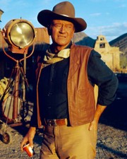 John Wayne stands by a lighting rig on the set of El Dorado 1967 Old Photo