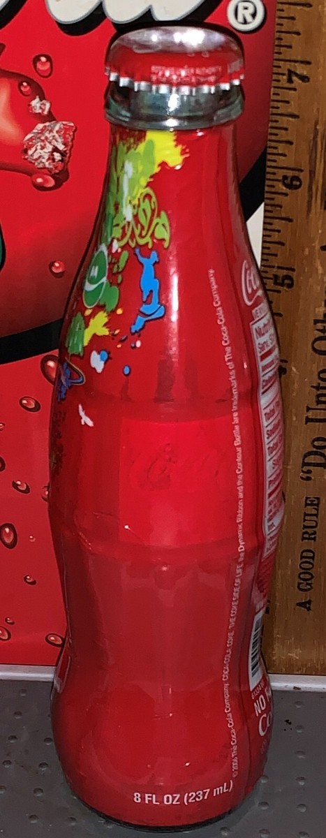 2006 WORLD OF COCA COLA BOTTLE BURST 8OZ GLASS WRAPPED COCA COLA