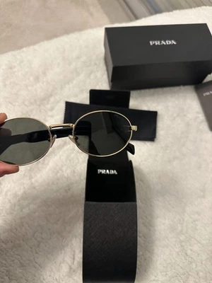 lunettes de soleil Prada doré - Photo 1/4