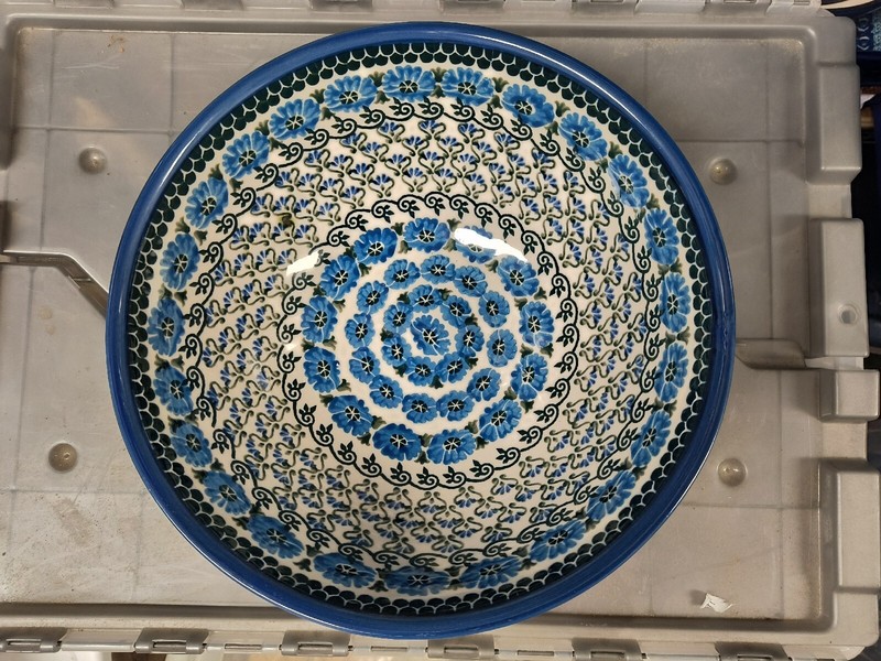 Polish pottery stoneware Boleslawiec bowl CA blue flower with flaw-- as is