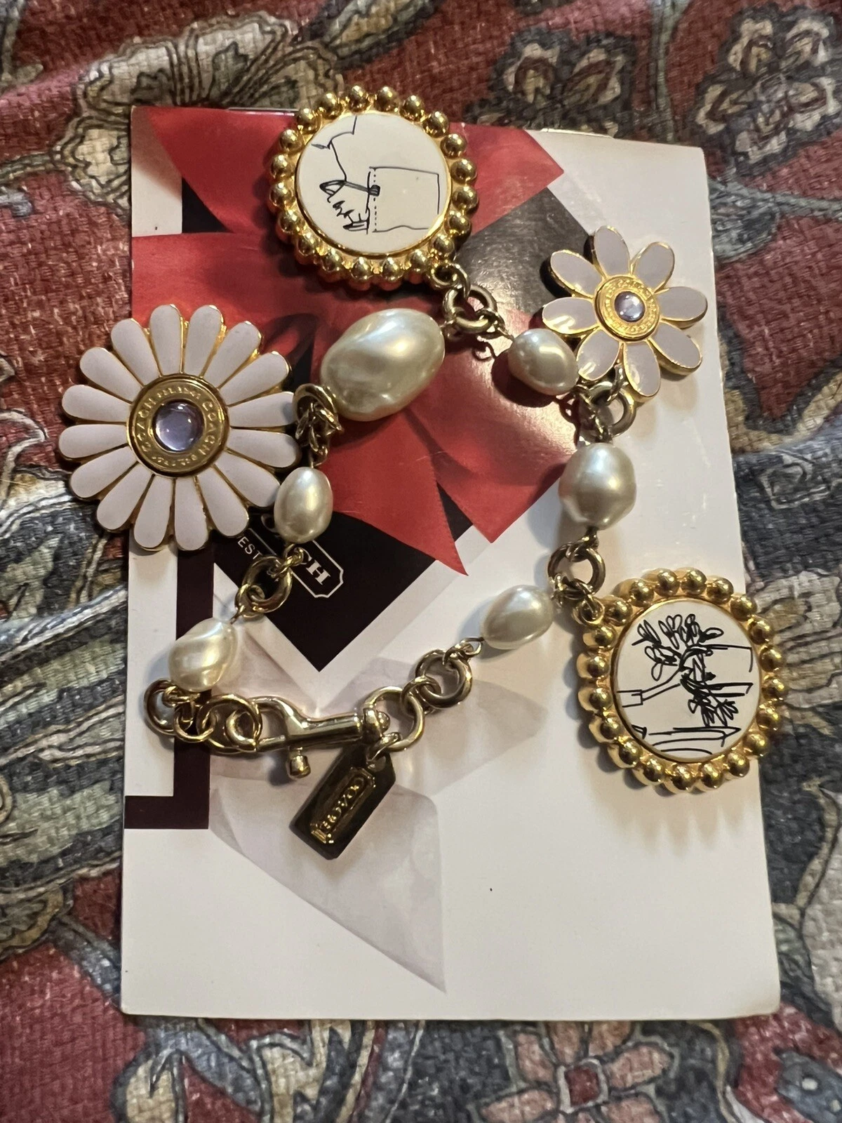 Bracciale Coach Bonnie schizzi e fiori multi charm us intime ottimeioni c tile st n.438