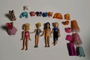 polly pocket con mucha ropa