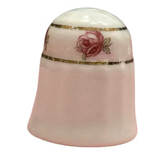 Sutherland, England porcelain thimble featuring a "Ring of Roses" design