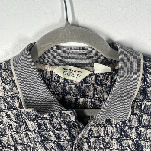Camisa polo de golf Reebok para hombre talla XL patrón cuadrado camuflada negra - Imagen 3 de 9