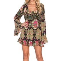 A bohemian-inspired mini dress with a flirty, Long, dramatic bell sleeves Size M