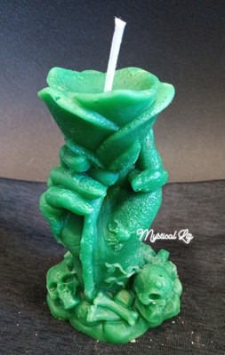 Hand Holding A Rose Manifestation Candle 