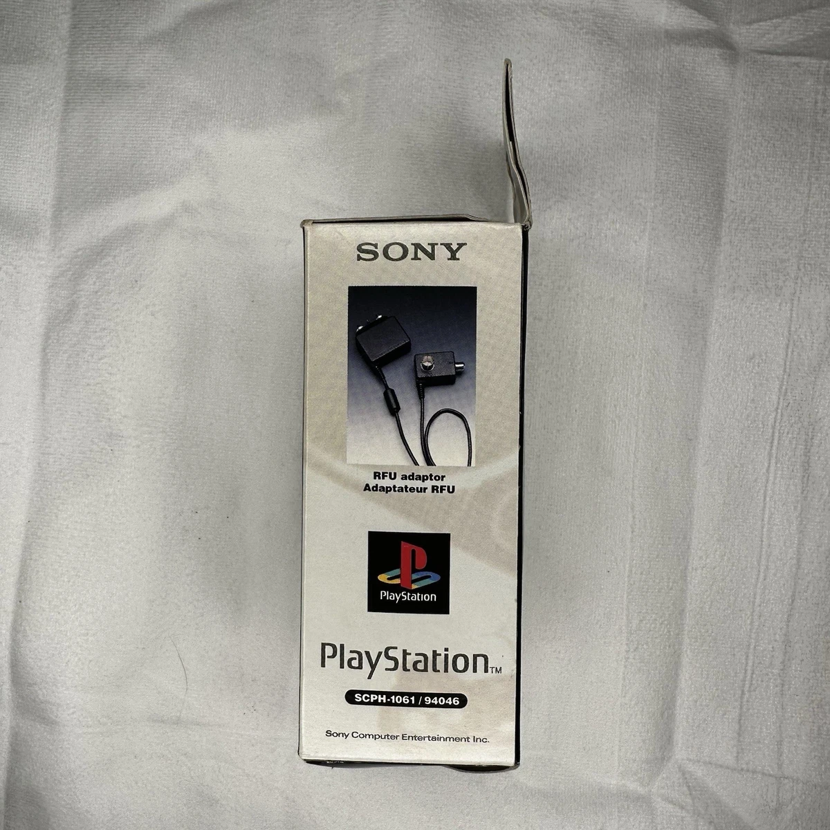 Adaptador RFU OEM Sony PlayStation (SCPH-1061, 94046) con caja y manual, probado