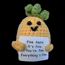 Hand Knit Pineapple Holding A Fine Apple Sign