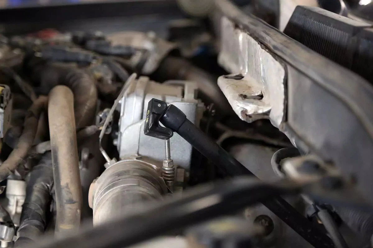 The automatic transmission dipstick resting in its tube.