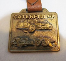 CATERPILLAR TRACTOR METAL WATCH FOB VINTAGE ADVERTISING CLEVELAND BROS. EQUIP PA