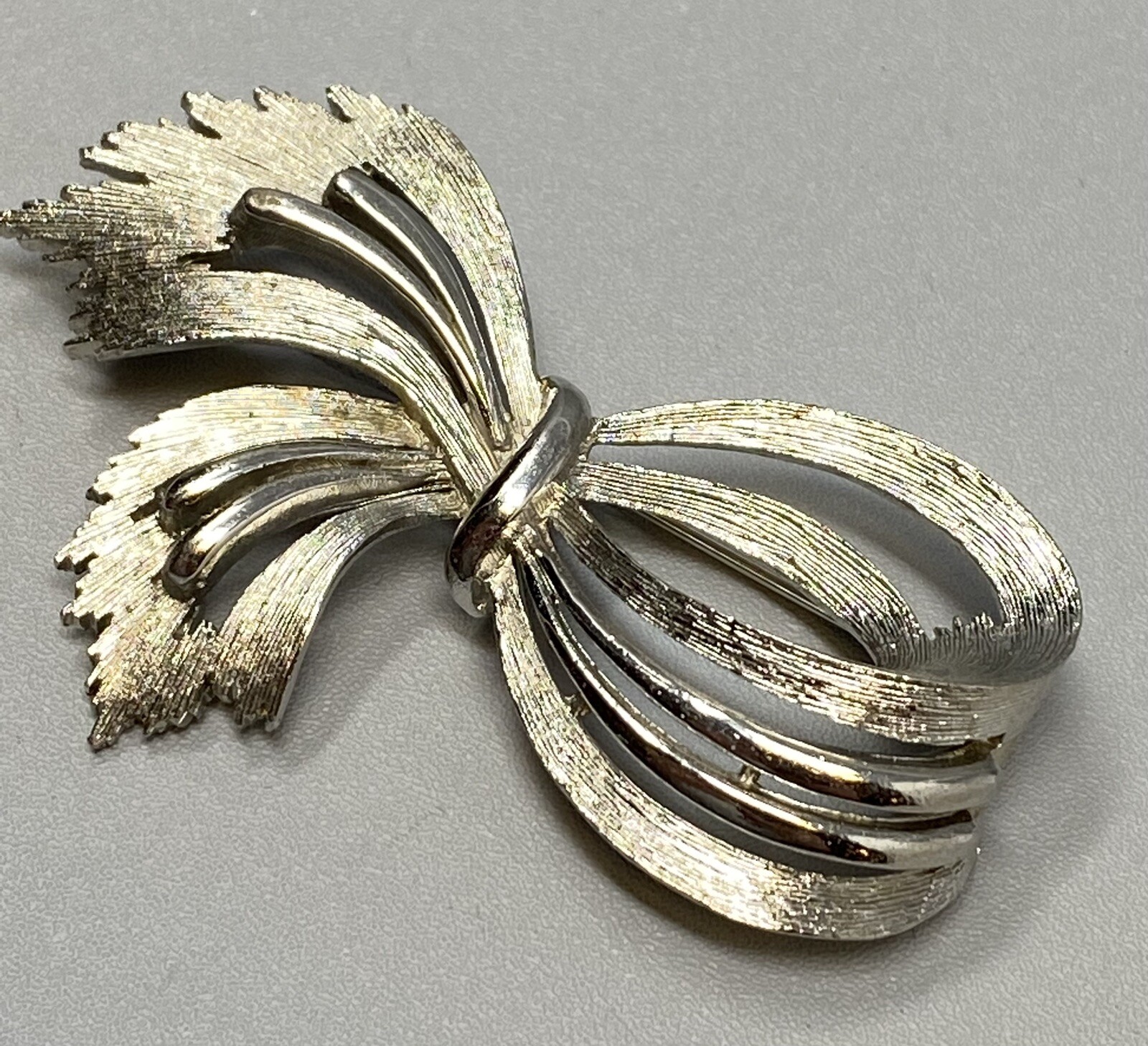 Jj Ribbons Vintage JJ Ribbon Brooch Silver Tone Brushed Open Work Bow Textured ...
