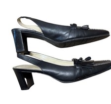 Vintage 1980  s Etienne Aigner Black Leather Slingback Heels in style today.