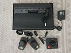 VINTAGE ATARI 2600 W/ 62 GAME CARTRIDGES