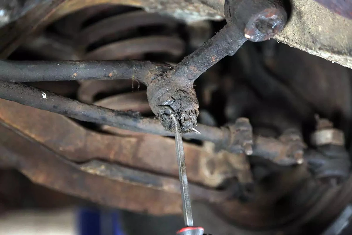 The cotter pin is removed from the idler arm with a cotter pin removal tool.