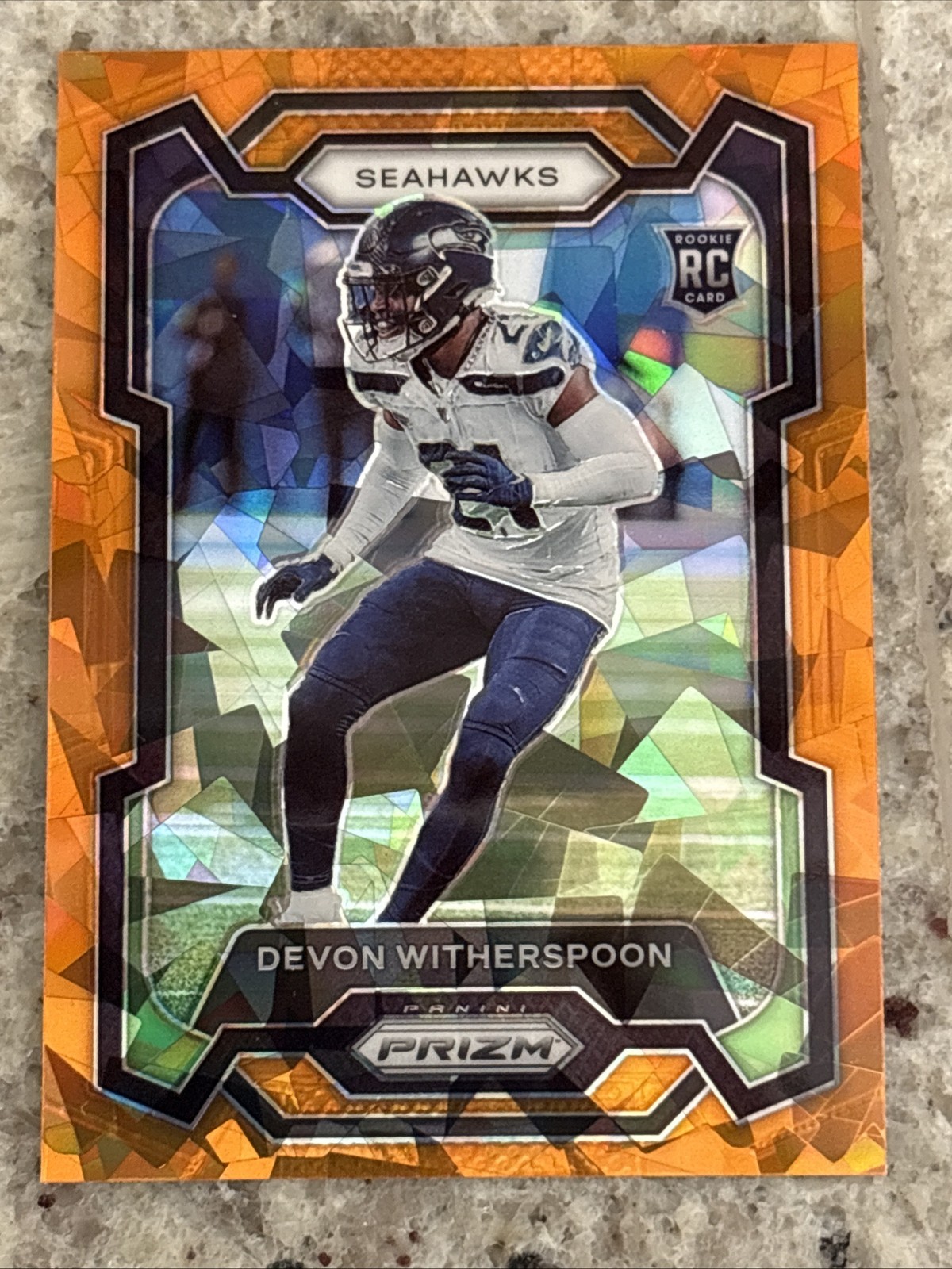 2023 Panini Prizm Football Devon Witherspoon RC Orange Cracked Ice Seahawks #389
