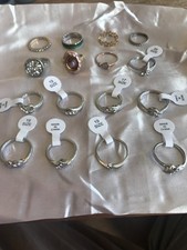16 Costume rings most still with tags attached