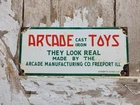 VINTAGE ARCADE TOYS PORCELAIN SIGN VERIBRITE ILLINOIS CHILDRENS CAST IRON GAMES