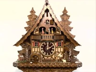 Quarz Kuckucksuhr Schwarzwaldhaus mit beweglichem Holzhacker un
