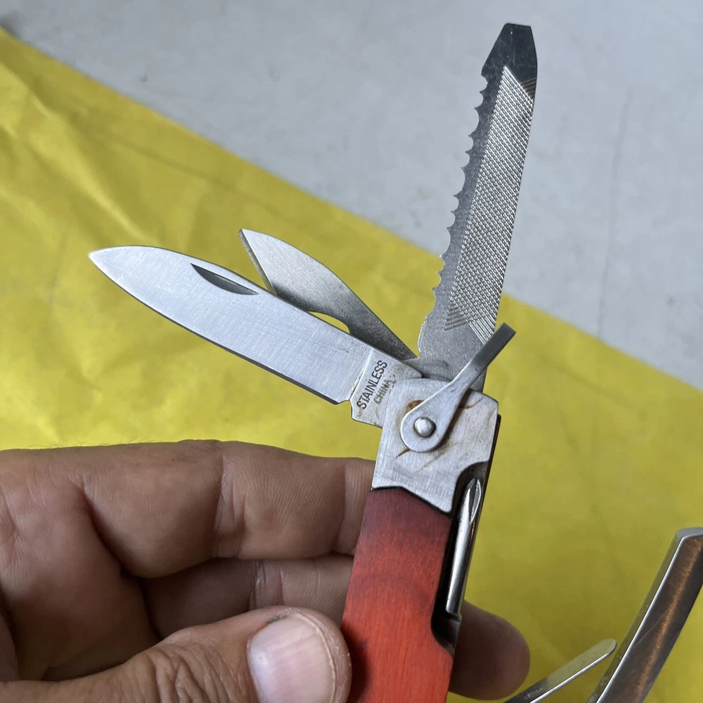 Compact Unbranded Multi-Tool with Knife, Saw, Hammer, Pliers & Bottle Opener (t11)