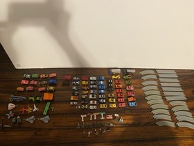 Vintage Micro Machines over 60 Mini Cars, Monster Trucks, Planes, and road.