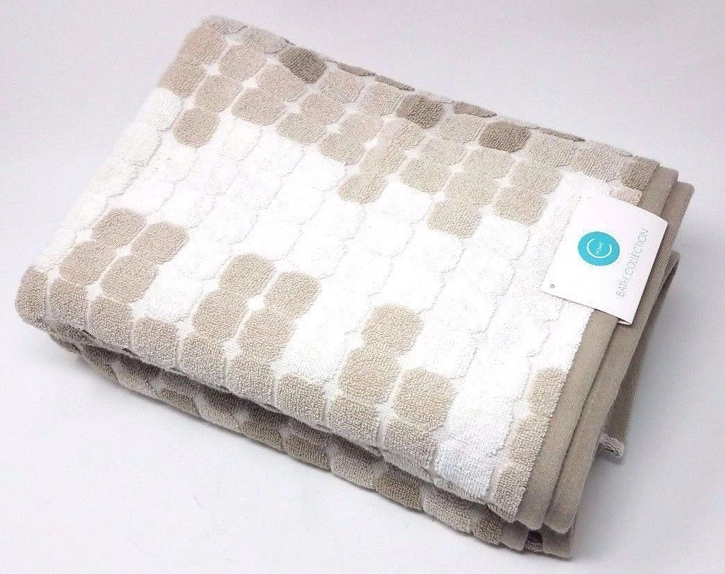 Tan and 2025 white bath towels