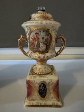Royal Vienna decor porcelain lidded urn with classical scenes and gold accents.