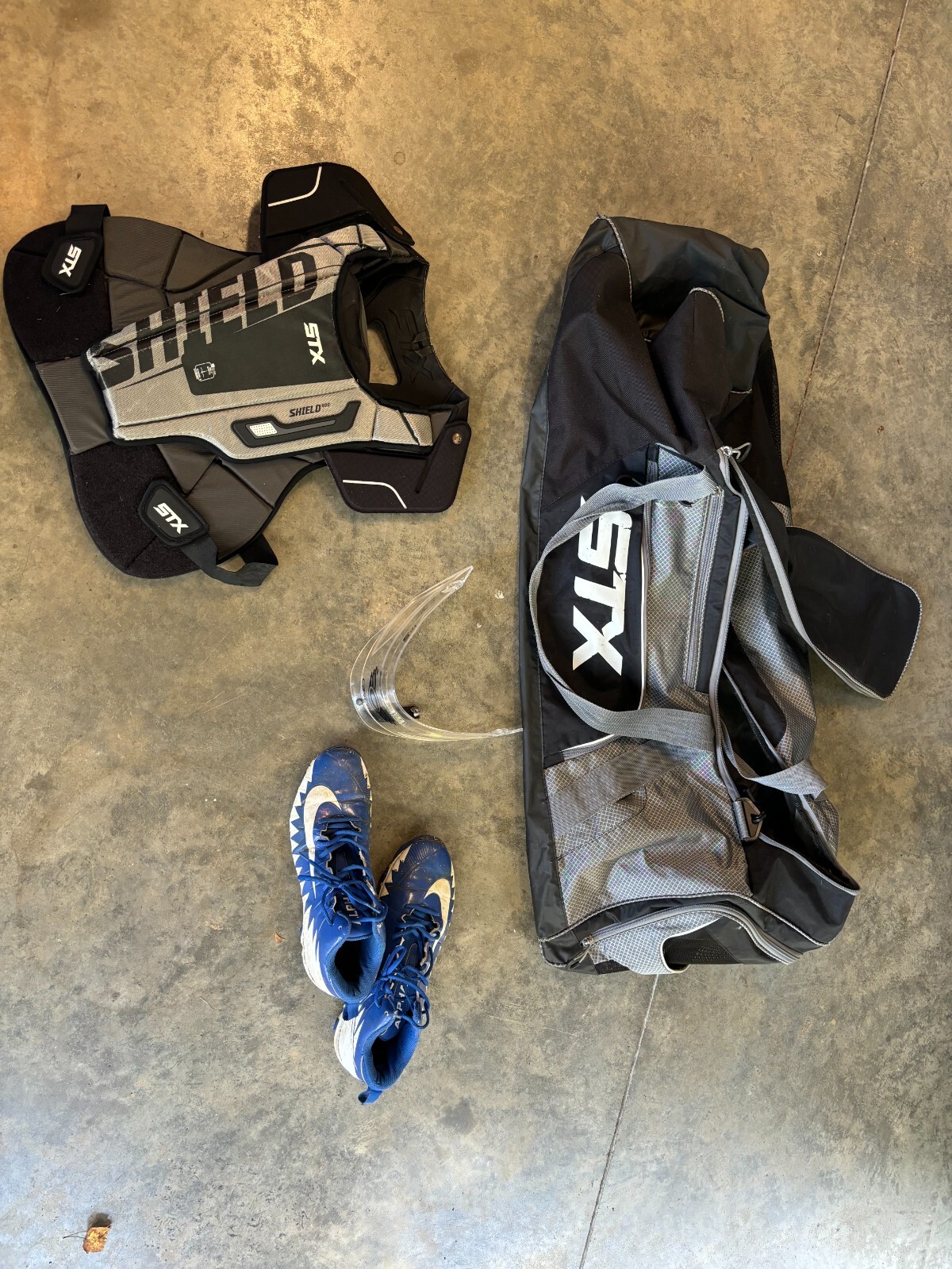 STX bag and goalie chest protector and throat guard and cleats size 11