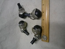 4 small vintage caster wheels USED 1970 - 1980 ? black balls in "foot" round