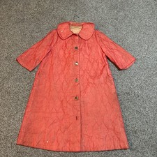 This vintage 1960s pink quilted housecoat robe