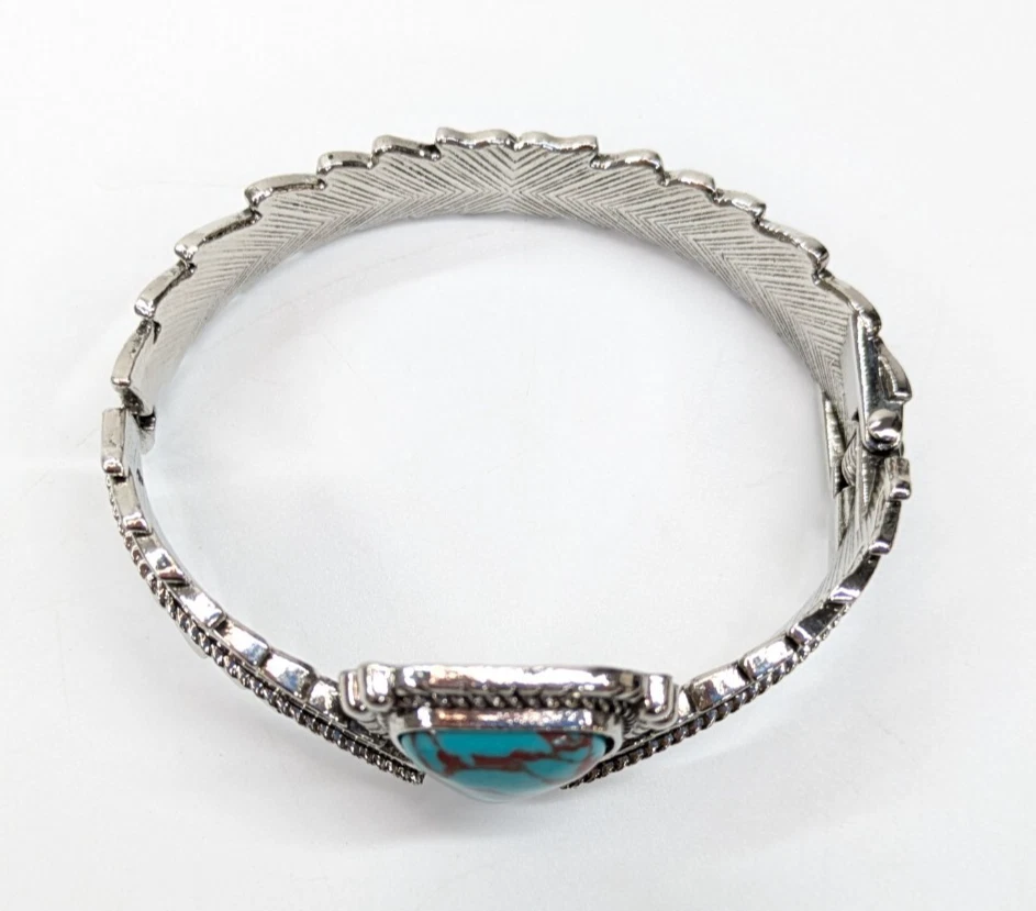 Brazalete grueso tono plata pluma imitación turquesa bisagras Foto 4 de 4