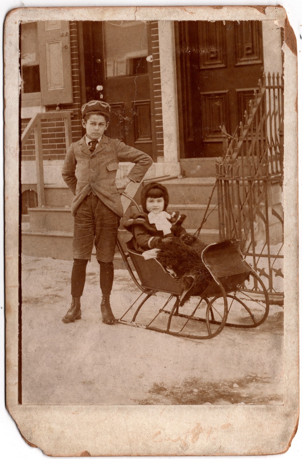 1895 CABINET CARD YOUNG BROTHER PUSHING SISTER AROUND IN SLED SNOWY DAY XMAS