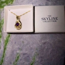 The Skyline Collection  18” necklace with amethyst pendant.