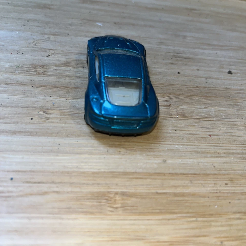 Hot Wheels Aston Martin DBS Metalflake Teal Gold FTE2 Faster Than Ever 1:64 #151 - Image 4 of 4