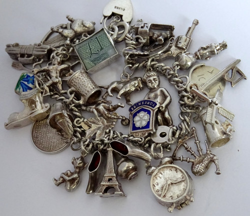 Vintage heavy solid silver charm bracelet 33 curious silver charms, open, moving