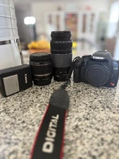canon eos rebel t1i digital camera with lens and camera bag