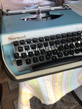 1960's light blue IMC Sherwood portable manual typewriter with carrying case thumbnail