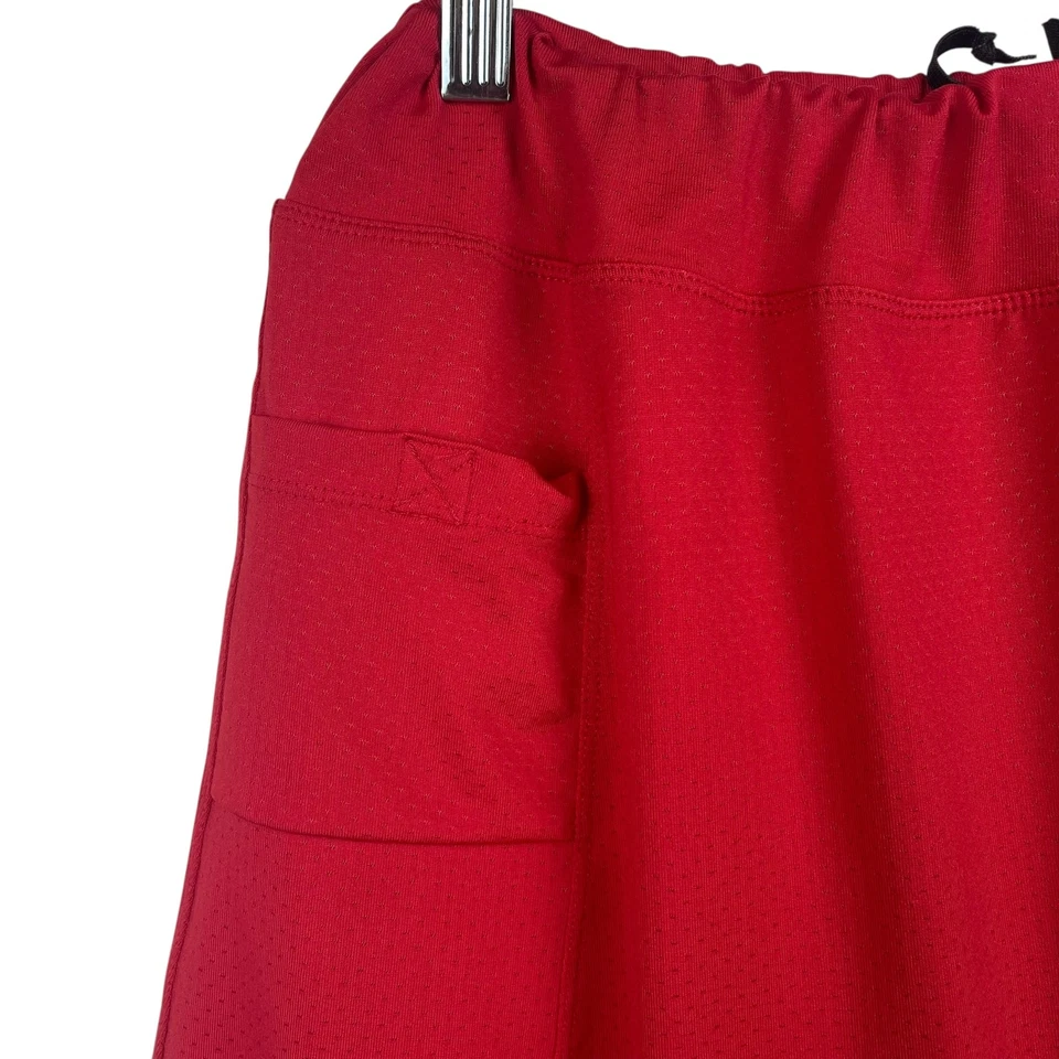 Faldas de running falda mujer mediana roja atlética cordón bolsillo rendimiento Foto 4 de 4