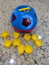 Tupperware Shape Sorter Red Blue Ball with 9 Yellow Geometric Shapes Toy