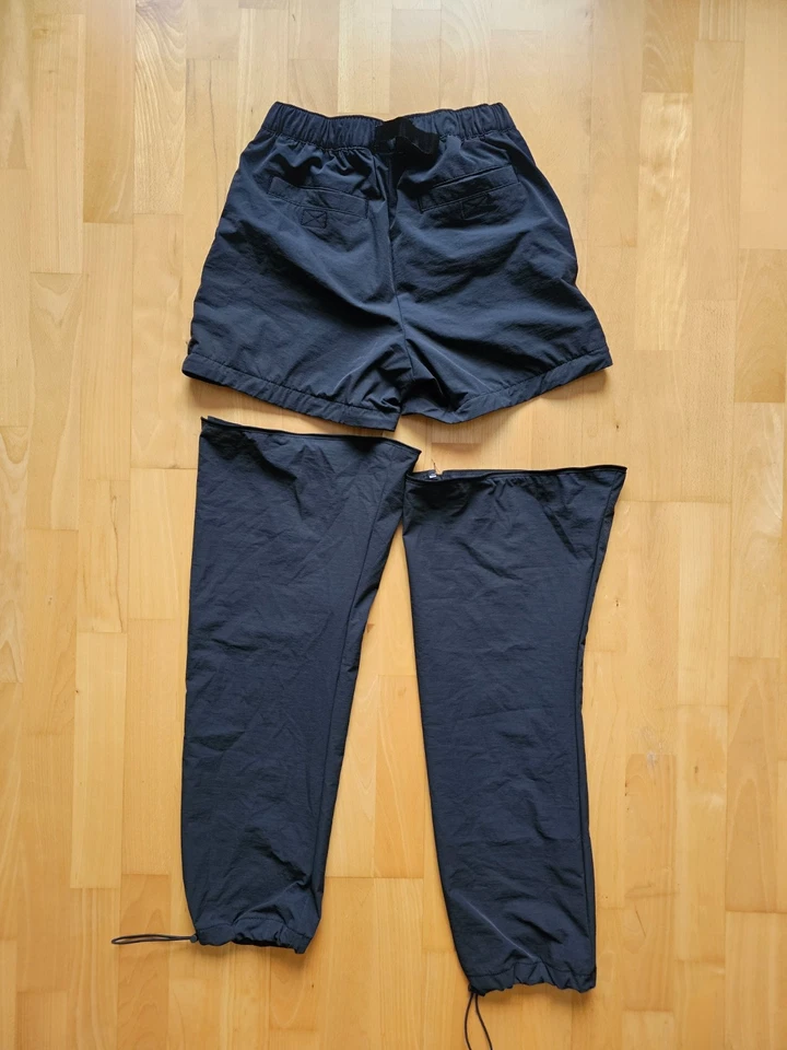 Pantalones cortos/pantalones sin paredes para hombre pequeños de nailon con cremallera convertible negro cinturón de senderismo Foto 2 de 4