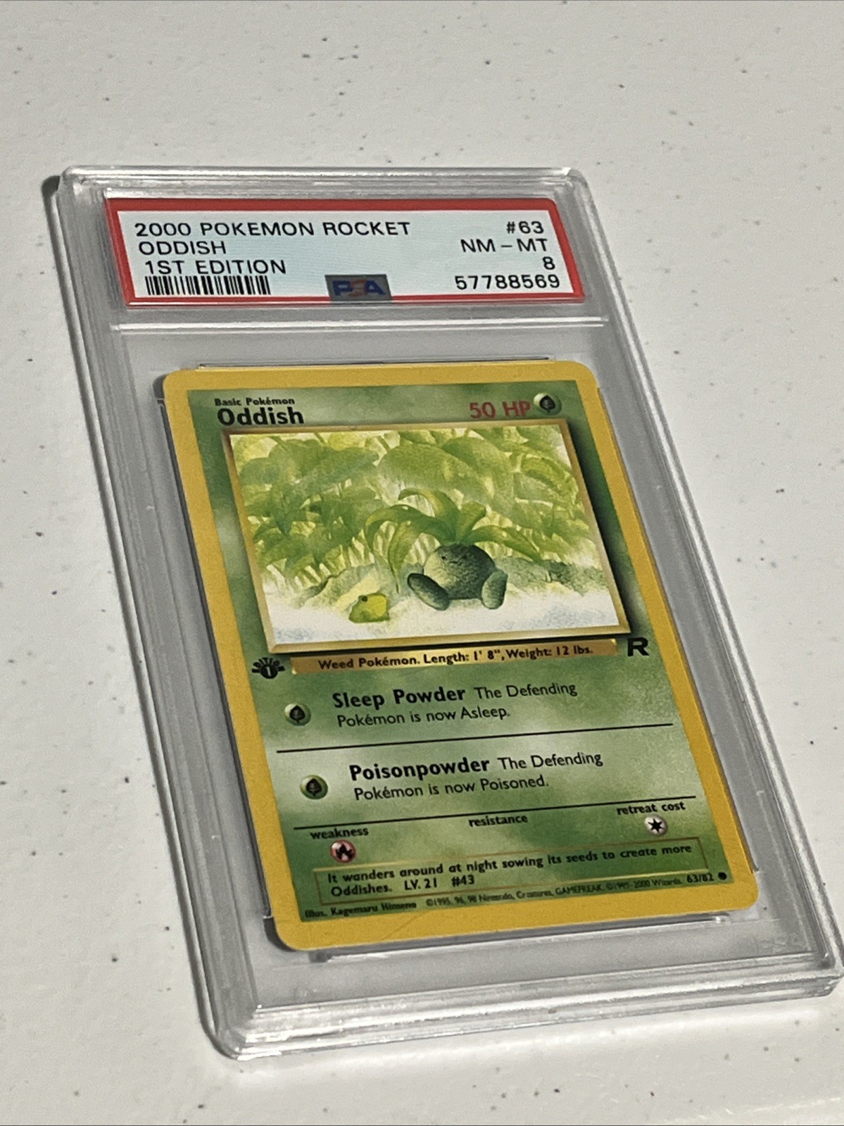 Pokemon - Team Rocket Oddish 63/82 First Edition PSA 8 Vintage