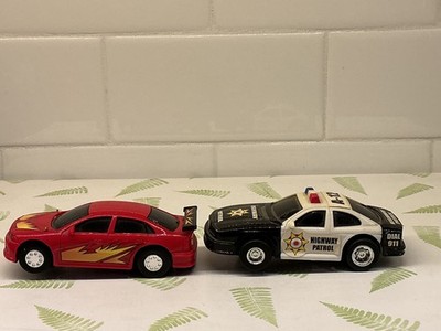 Lot of 2 Slot Cars 1:43 Scale Black & White Highway Patrol & Red Sedan.