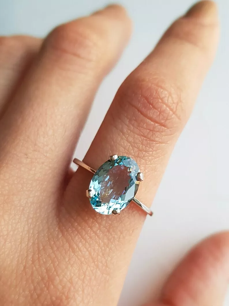Solitaire aquamarine best sale ring