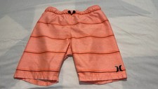 Hurley boys orange stripe swim trunks, size 5/6, with black accents