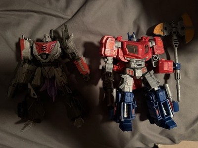 Hasbro Transformers War for Cybertron MTMTE Optimus Prime and Megatron COMPLETE