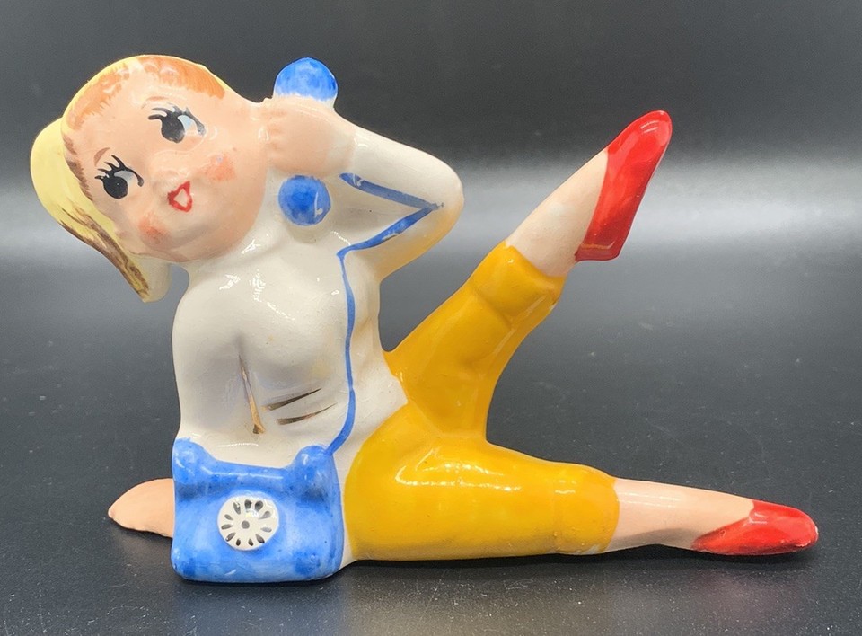 Kitschy mid-century ceramic 'Teeny Bopper' girl-on-phone figurine from Japan — the kind of charming retro oddity that instantly steals a shelf.