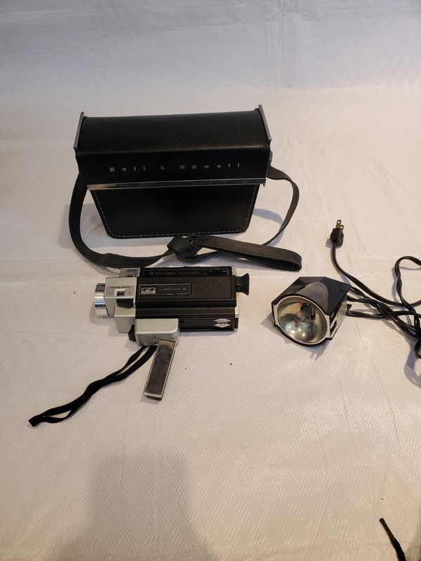 Vintage Bell & Howell Movie  Camera Model# 379S With Flash and Carrying Case.