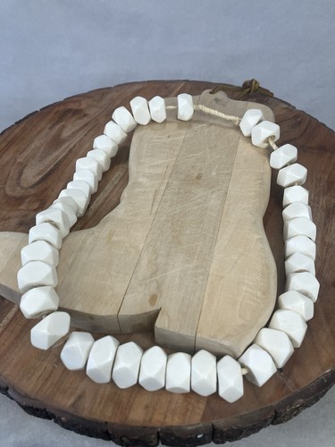 Strand of faceted white bone beads
