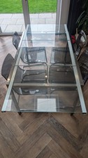 IKEA Glivarp Extendable Dining Table Glass+ Chrome. With 4 clear perspex Chairs